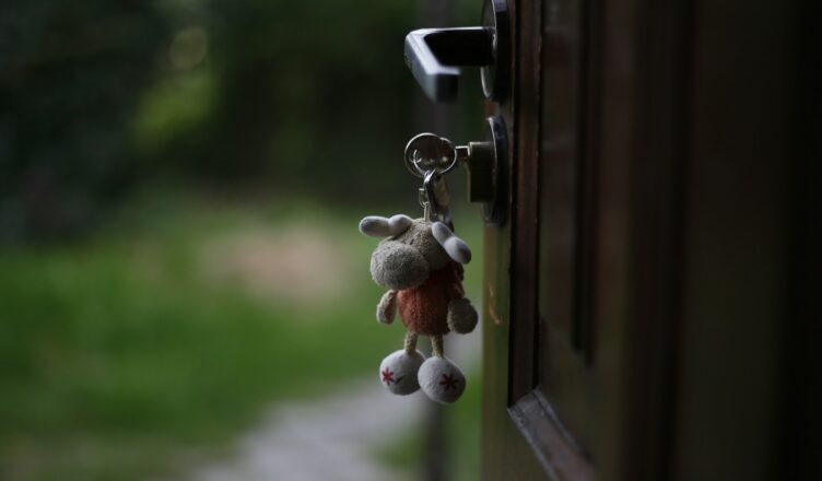 a key chain hanging from a door handle